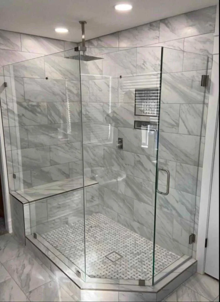 Marble tiled shower in a bathroom renovation project in Calgary