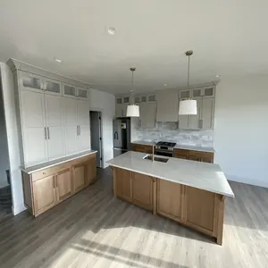 Open layout kitchen cabinetry design in Calgary with elegant countertops and ample storage.