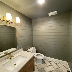 Chic bathroom renovation in Calgary with a blend of modern and classic elements.