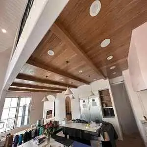 Custom carpentry in a Calgary home, highlighting elegant wooden beams and fixtures.