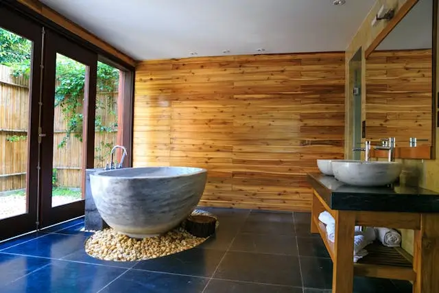 A serene bathroom interior with wooden walls and a sleek design.